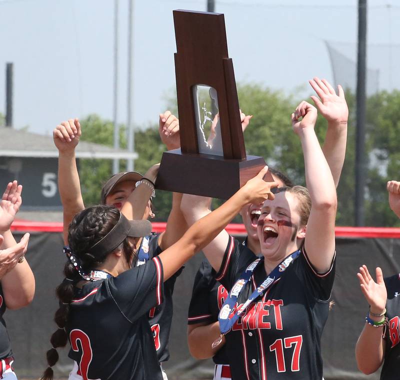 Benet Academy players Taylor Sconza and Bridget Chapman hoist the Class 3A State softball third place trophy on Saturday, June 10, 2023 at the Louisville Slugger Sports Complex in Peoria.