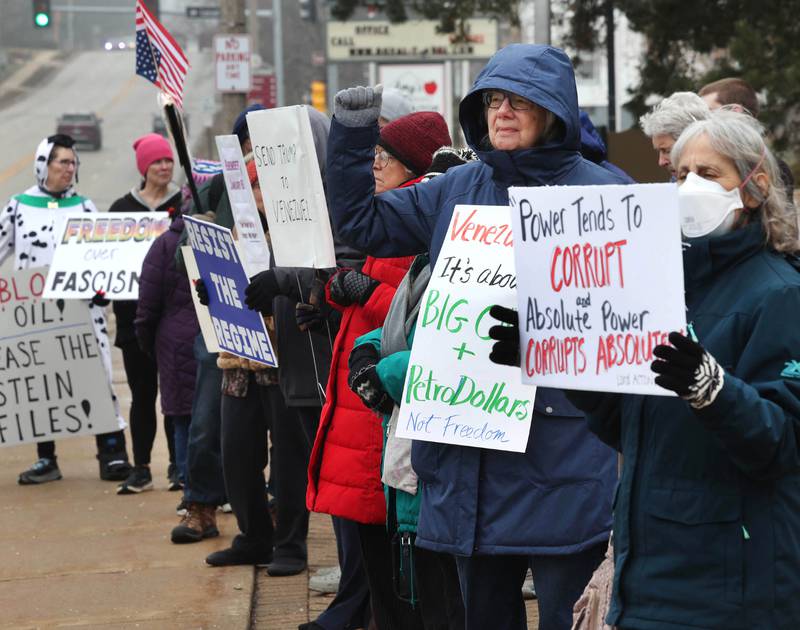 Protesters gathered Tuesday, Jan. 6, 2026, for a Venezuela Rapid Response Rally at Memorial Park on the corner of First Street and Lincoln Highway in DeKalb, to voice their opposition to President Donald Trump and the administrations recent actions in Venezuela.