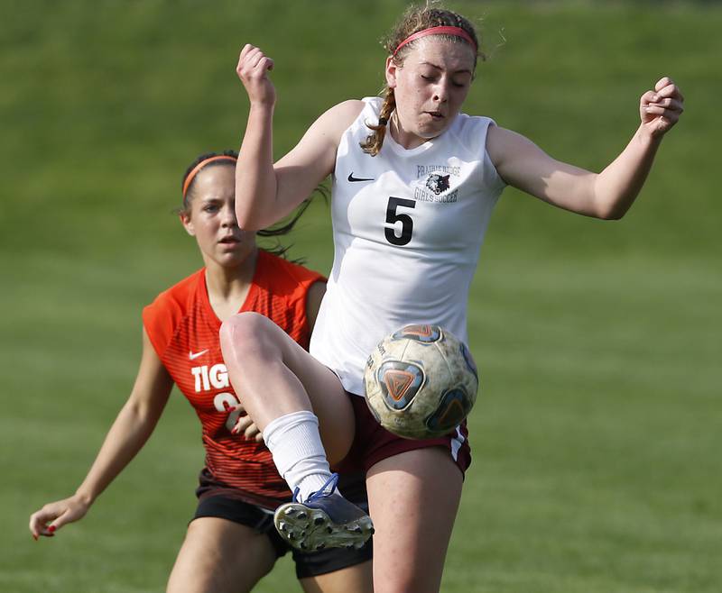 Prairie Ridge's Olivia McPherson controls the ball in front of Crystal Lake Central's Olivia Madalinski during a Fox Valley Conference soccer match Tuesday, May 10, 2022, between Crystal Lake Central and Prairie Ridge at Crystal Lake Central High School.