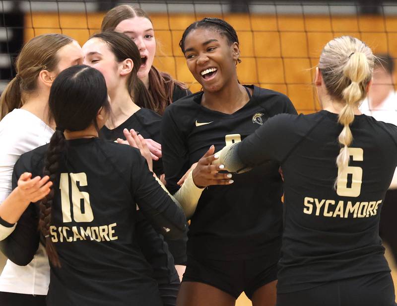 Sycamore players celebrate a point against Rochelle Tuesday, Oct. 28, 2025, during their Class 3A regional semifinal match at Rochelle High School.