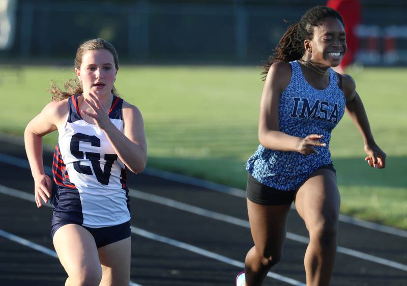 St. Viator’s Maeve Gottfred runs the 100 meters Friday, May 15, 2026, during the Class 2A girls track sectional at Genoa-Kingston High School.