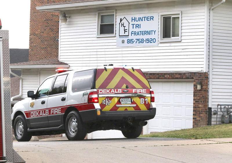A DeKalb Fire Department vehicle sits next to the property at 930 Greenbrier Road in July after the building was the site of a fire that damaged the ground level floor and displaced residents.