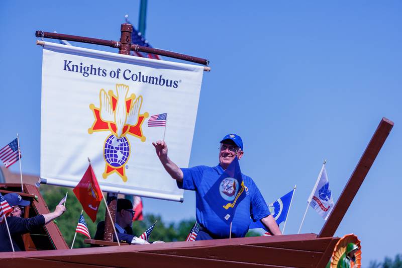 Bill Roth waves to the crowd on the Knights of Columbus float at the Memorial Day parade on Monday, May 25, 2026, in St. Charles.