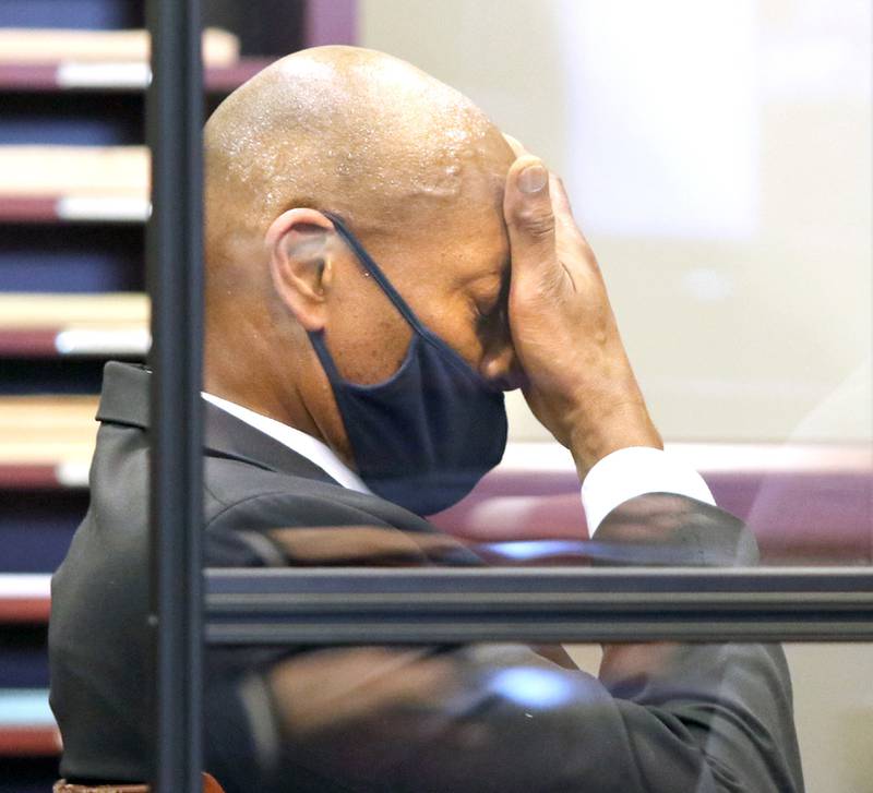 Shawn Thrower wipes away sweat during his trial Thursday as he hears the verdict, read by DeKalb County Circuit Court Judge Joseph Pedersen, finding him guilty of two counts of battery stemming from an incident with one of his employees at his Sycamore coffee shop in February.