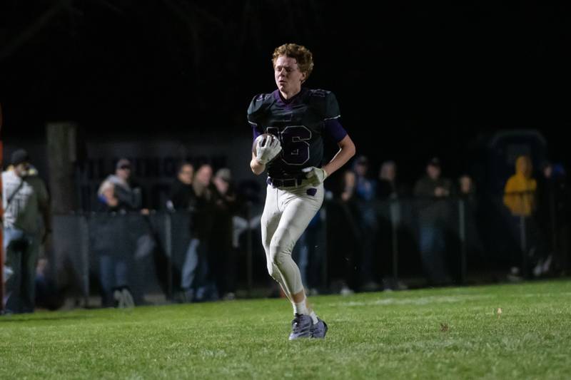 Wilmington's Dane Van Duyne carries the ball during the Wildcats' 49-7 victory over Tri-Valley in the quarterfinal game on Saturday, Nov. 15, 2025.
