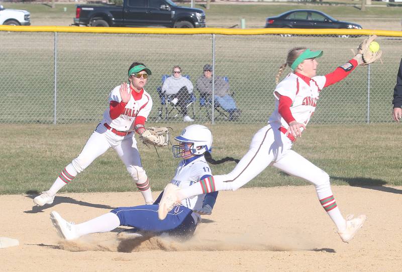 Princeton's Keely Lawson slides safely into second base as L-P's Callie Mertes (left) and teammate Ava Lambert move to the ball on Tuesday, March 19, 2024 in Princeton.