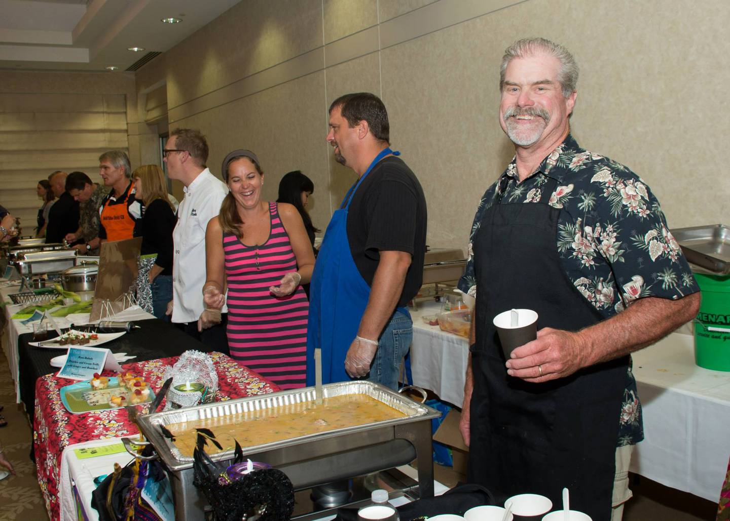 Brent Olson, right, has served as a chef for 50 Men Who Cook for 17 years. The brother of CASA DeKalb County's Executive Director said he enjoys the sense of friendly competition between chefs.