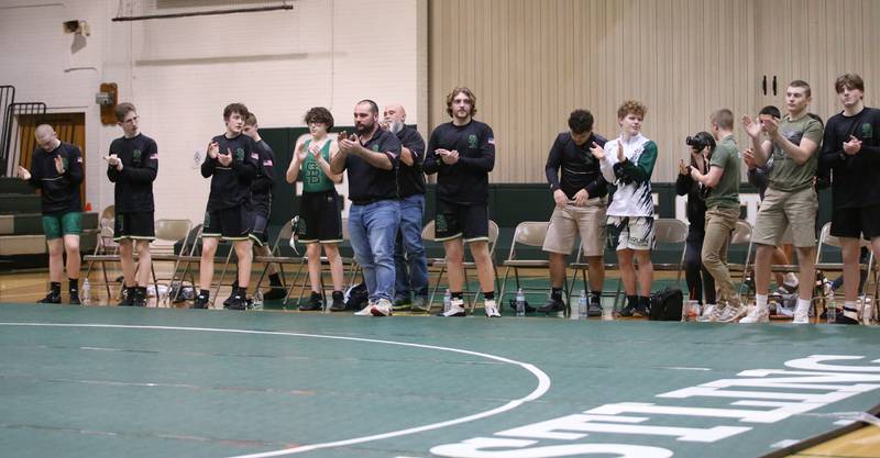 Members of the St. Bede wrestling team cheer on their teammates during a triangular meet on Wednesday, Jan. 18, 2023 at St. Bede Academy.