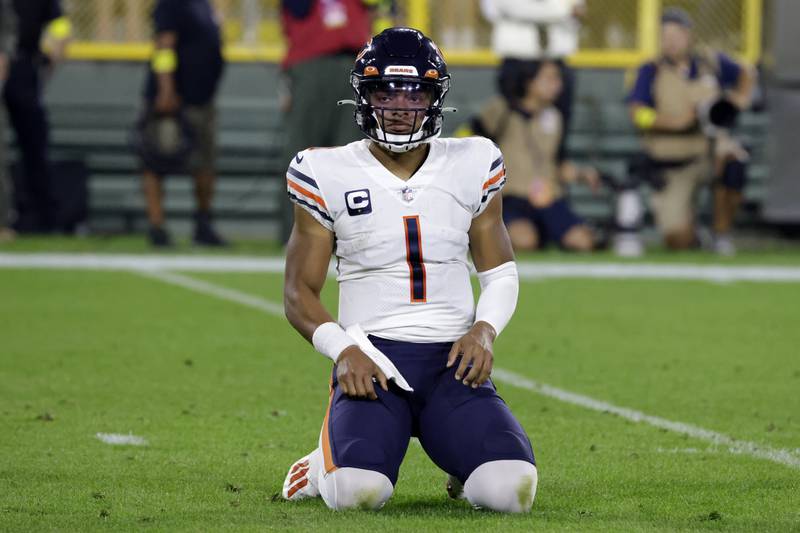 Chicago Bears quarterback Justin Fields reacts during the first half of an NFL football game against the Green Bay Packers Sunday, Sept. 18, 2022, in Green Bay, Wis. (AP Photo/Mike Roemer)