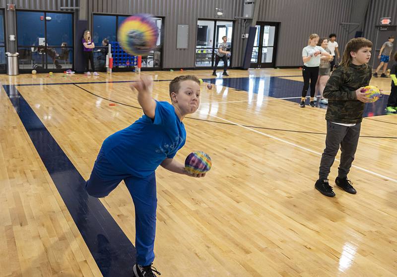 An after school participant fires a ball during a game Wednesday, March 8, 2023 at The Facility in Dixon.