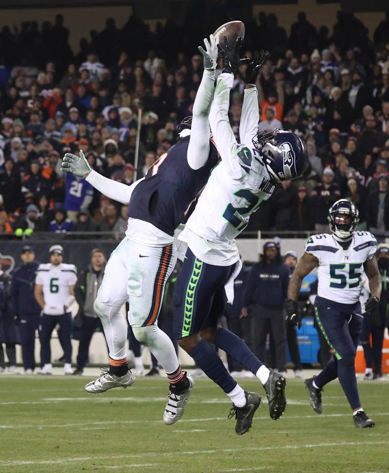 Seattle Seahawks cornerback Riq Woolen intercepts the pass intended for Chicago Bears wide receiver Keenan Allen to seal the victory for Seattle Sunday, Dec. 26, 2024, at Soldier Field in Chicago.