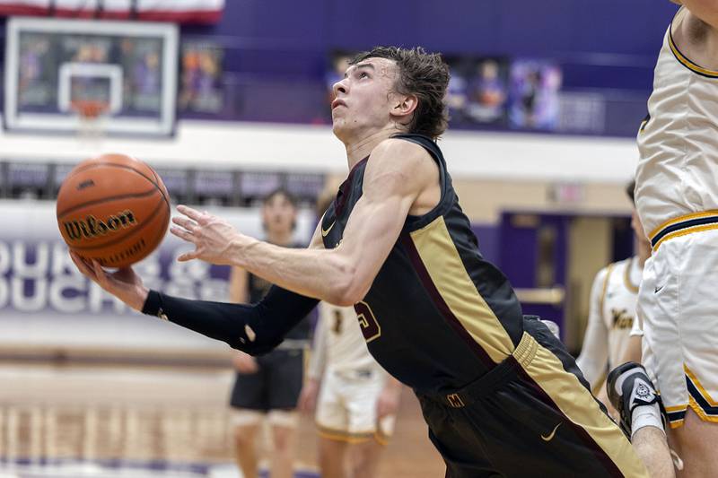 Morris’ Caston Norris puts up a shot after being tripped up against Sterling Wednesday, Feb. 22, 2023 in the 3A sectional semifinal game.