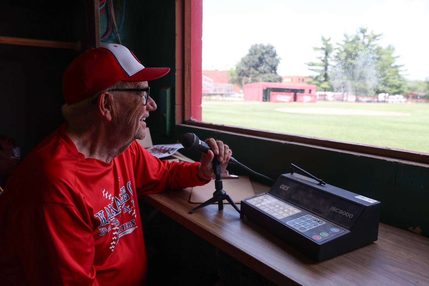 Roy Cordes looks out at the Kankakee Community College Cavaliers baseball field from the press box on Tuesday, June 23, 2025. Cordes, who began calling games in 2008 and recently retired, said he's called over 1,500 games in his time as "the voice of the Cavaliers