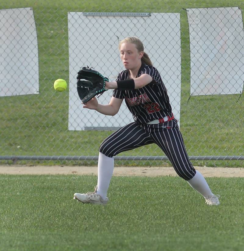 Forreston's McKenna Rummel focuses on the ball as she fields a hit to left field on the hop during a Monday, May 12, 2025 game with Lena-Winslow at Forreston High School.