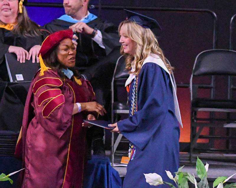 Oswego High School senior Laila Lu Green is all smiles as he receives his diploma on Saturday May 17, 2025, during the graduation Ceremony held at the Convocation Center in DeKalb.