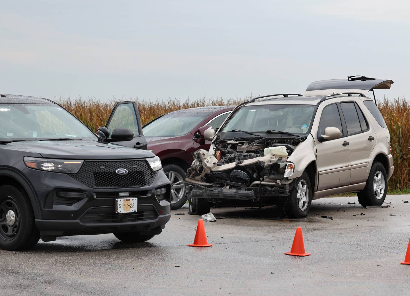 A Kendall County Sheriff vehicle sits near two other vehicles that were involved in acrash with a Newark school bus Thursday, Sept. 21, 2023, at the intersection of N4750th Road and Millington Road near Sandwich.