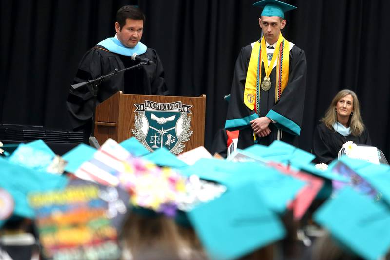 Valedictorian Anthony Bigler is recognized by Principal Josh Segura during graduation at Woodstock North High School in Woodstock on Saturday, May 17, 2025.