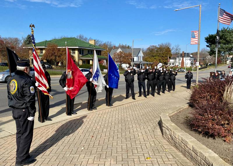 Members of the American Legion Post No. 66 Honor Guard give a ceremonial gun salute during the Legion's annual Veterans Day ceremony in downtown DeKalb Saturday, Nov. 11, 2023.