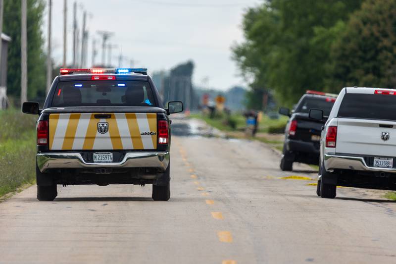 Law enforcement vehicle drives down 42nd Road towards crime scene of a double homicide on Thursday, July 17, 2025 in Sheridan.