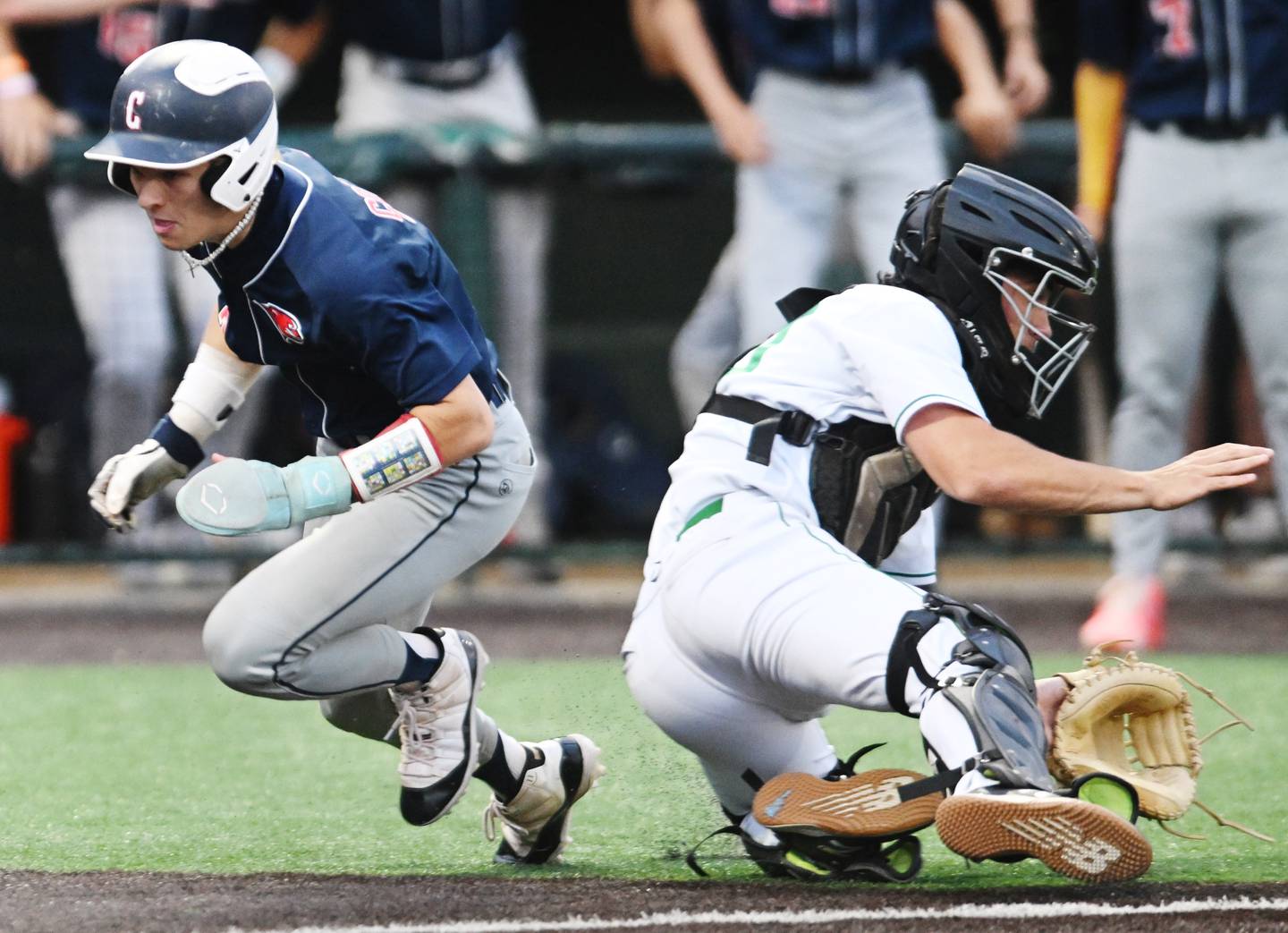 York catcher Noah Jones takes the late throw at home as Conant's Jake Parpet scores in the bottom of the sixth inning during the Class 4A state baseball semifinal at Duly Health and Care Field on Friday, June 7, 2024 in Joliet.