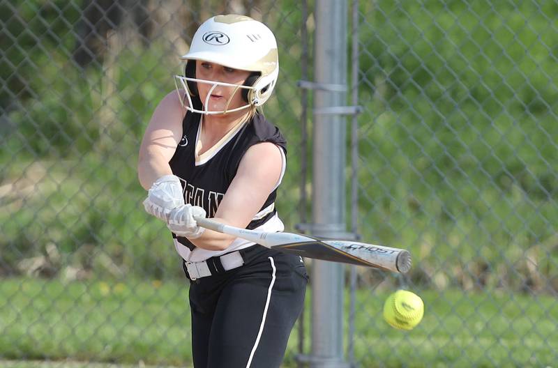 Sycamore's Addison McLaughlin slaps the ball to the left side during their game against Dixon Thursday, May 12, 2022, at Sycamore High School.