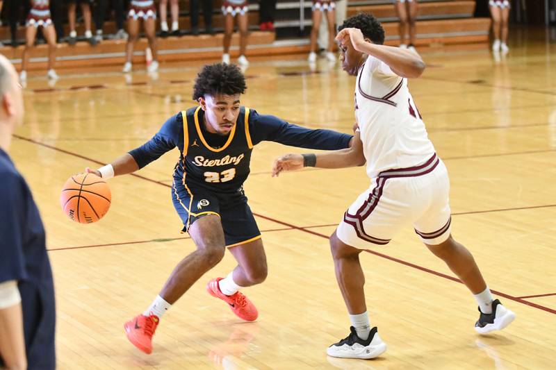 Sterling's Kaedon Phillips drives against Kankakee's Myair Thompson during the Kays' 85-50 victory over Sterling in the IHSA Class 3A Morris Regional championship on Friday, Feb. 28.