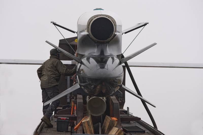 Workers and military inspect Ukrainian Fire Point's Flamingo missiles during handover to the military in an undisclosed location in Ukraine Thursday, Dec. 4, 2025. (AP Photo/Efrem Lukatsky)