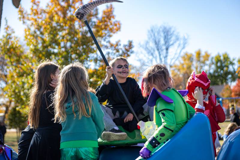 Kids in Halloween Costumes play at the annual trick or treat at Washington park on Saturday, October 26, 2024 in Peru.