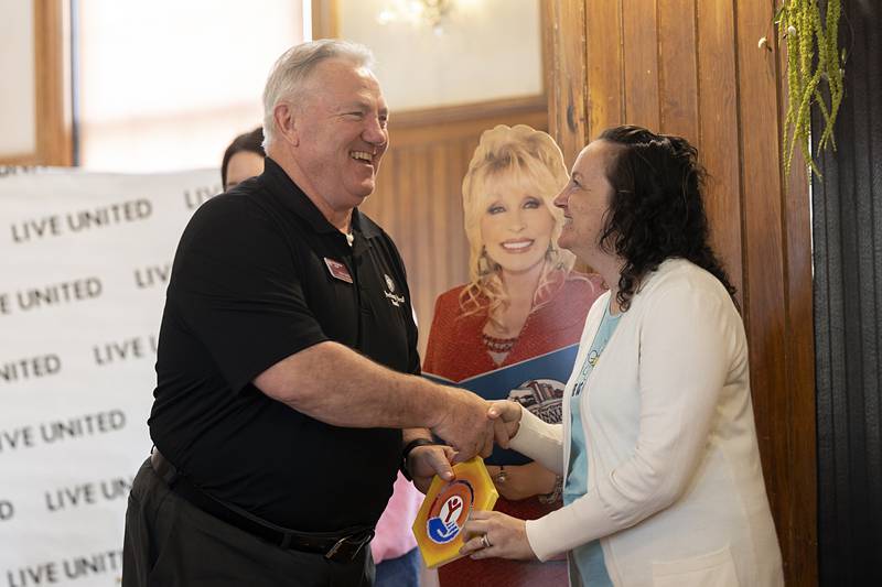 Longtime United Way board member Mike Smith receives the Campaign Champion award from Samantha Schmitt on Tuesday, May 12, 2026, during the campaign luncheon. Rising Star of the Year award went to Noah Grot, Small Business of the Year went to Coffee Crush and the Spirit of United Way went to Ken Nelson.