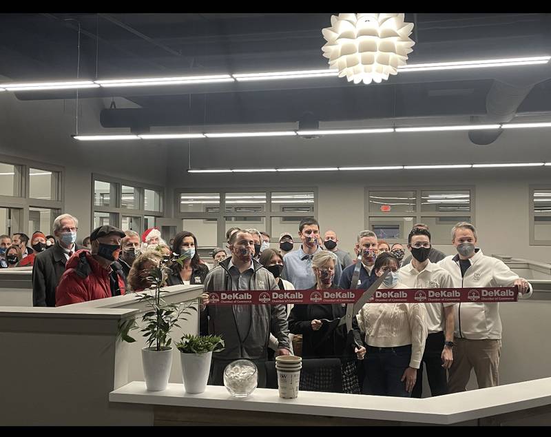 Members of the DeKalb Chamber of Commerce, Proven Winners and OC Creative prepare for the  Winterbash: Winter Wonderland ribbon-cutting on Tuesday, Dec. 7, 2021.