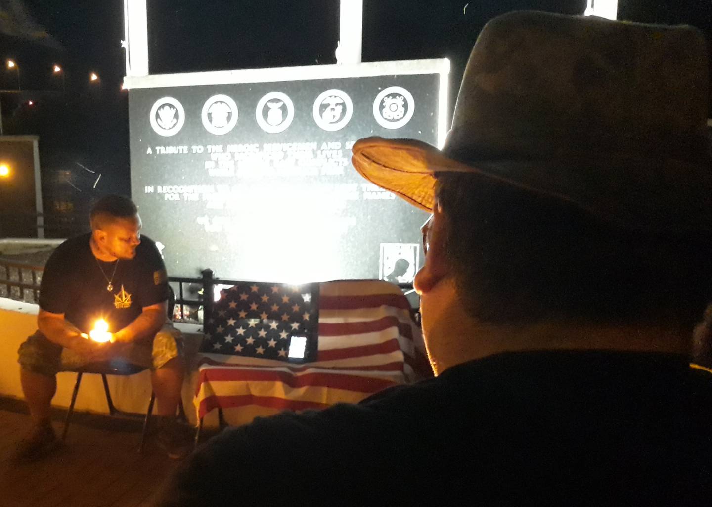 Joseph Combs, who was twice deployed serving in the Tennessee Army National Guard, speaks Saturday, Aug. 13, 2022, during a candlelight vigil at the Middle East Conflicts Wall in Marseilles about his friend Anthony Seig, who was killed in combat a week before turning 20 years old.
