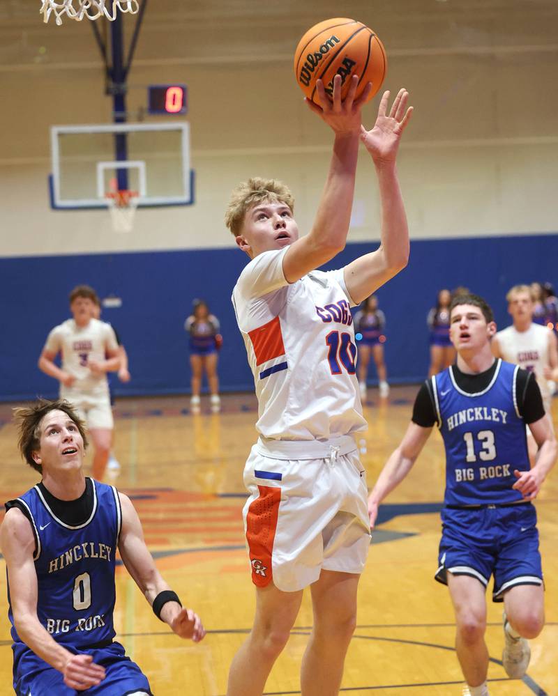 Genoa-Kingston's Trevor Rhoads gets a layup in front of Hinckley-Big Rock's Harrison Nier Tuesday, Jan. 6, 2026, during their game at Genoa-Kingston High School.