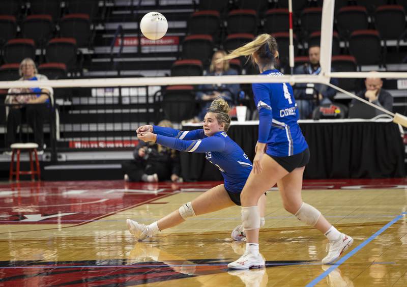 Newman’s Sam Ackman plays a serve Friday, Nov. 11, 2022 in a class 1A volleyball semifinal against Aquin.