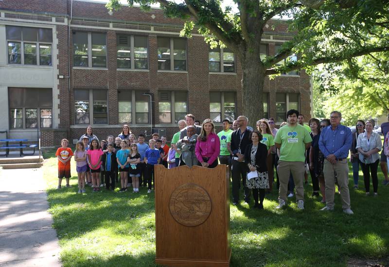 Lincoln Elementary students and local noble dignitaries pose for a photo outside of Lincoln Elementary School on Thursday, May 30, 2024 in Mendota. Illinois Transportation awarded Mendota for new sidewalks that help students more opportunities to walk, bike and roll as part of the Safe Routes to School Program.