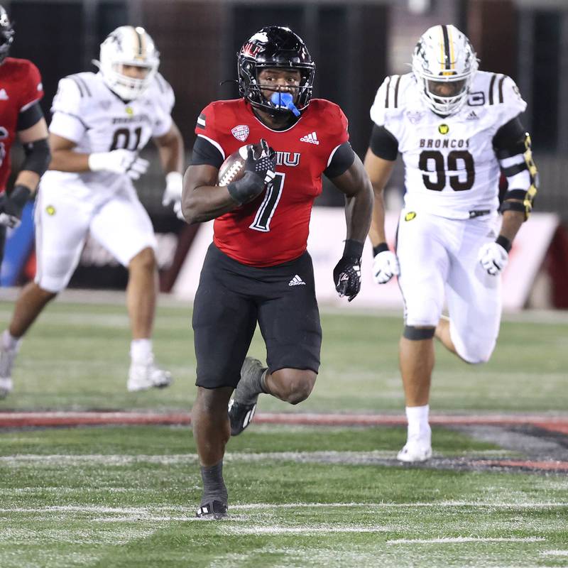 Northern Illinois' Antario Brown breaks through the Western Michigan defense on his way to a 66 yard touchdown run during their game Tuesday, Nov. 14, 2023, in Huskie Stadium at NIU in DeKalb.