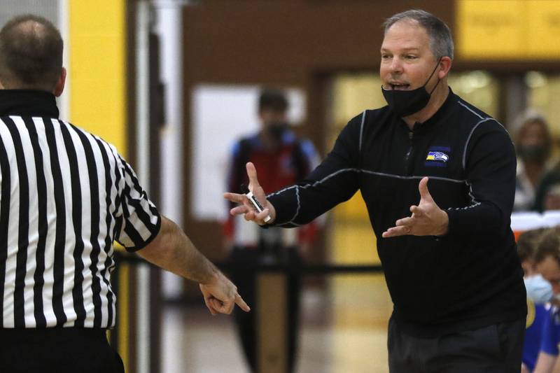 Johnsburg coach Mike Toussaint pleads his case with an official during their Hinkle Holiday Classic boys basketball tournament game against Crystal Lake South at Jacobs High School on Wednesday, Dec. 22, 2021 in Algonquin.