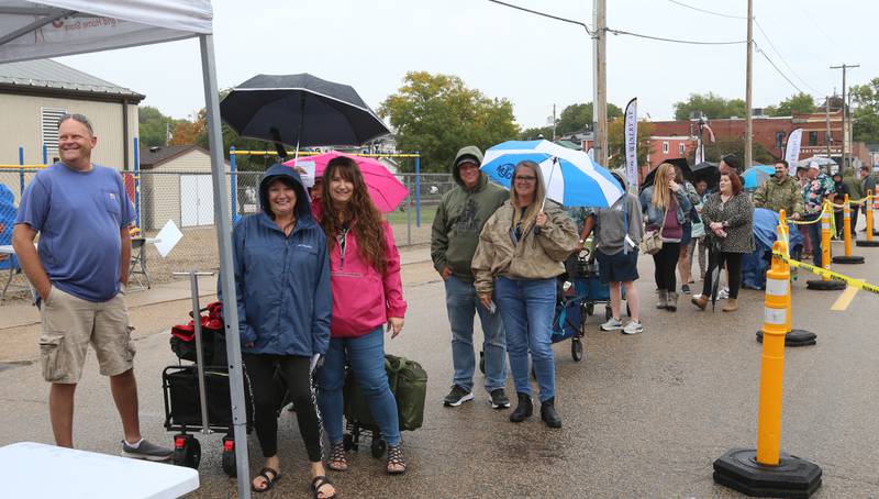 A long line of people stand outside to get into the 20th annual Vintage Illinois Wine Festival on Sunday, Sept. 17, 2023 in Utica.