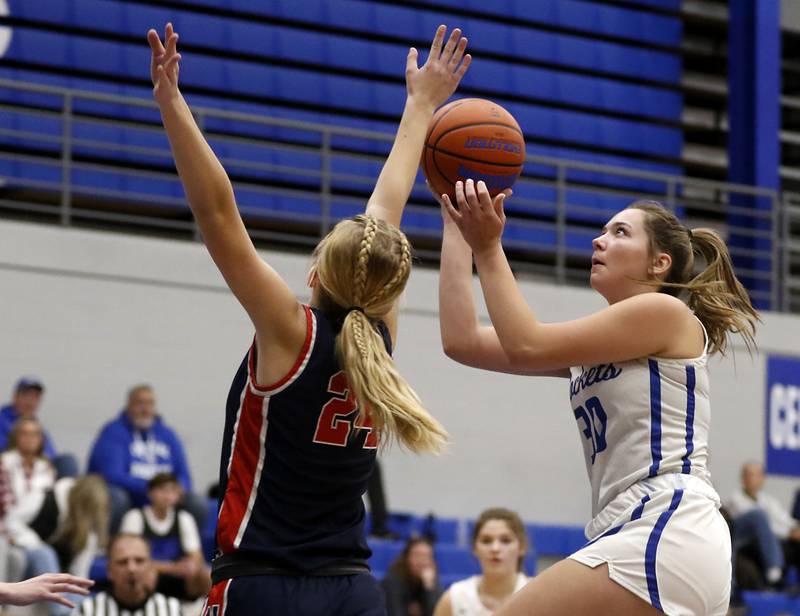 Burlington Central's Emma Payton drives to the basket against Belvidere North's Brooke Bottcher on Monday, Nov. 13, 2023, during pool play girls basketball game in the Burlington Central Mark Einwich Tournament.