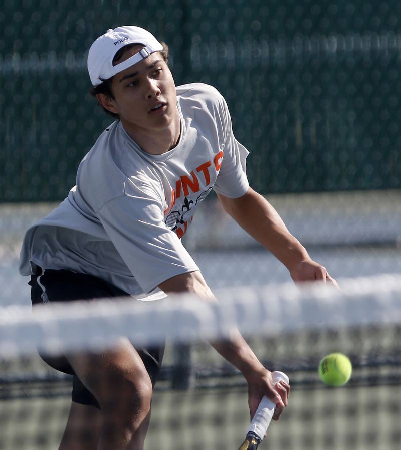St. Charles East’s Tiernan Price returns the ball as he competes in the Class 2A Boys State Tennis Tournament on Thursday, May 23, 2024, at Hersey High School in Arlington Heights.