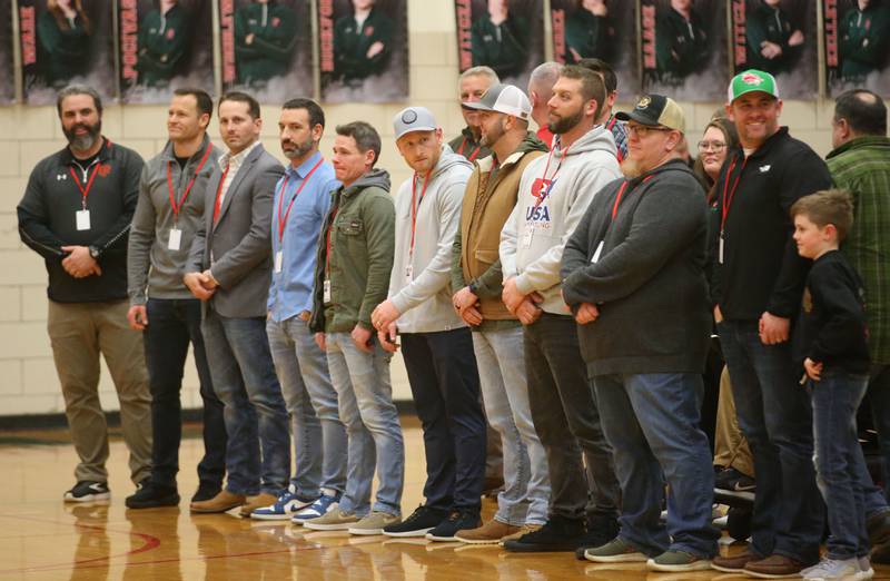 Members of the L-P 1999-2000 boys wrestling team is introduced at halftime during the La Salle-Peru Township High School Hall of Honor ceremony on Friday, Feb. 7, 2025 in Sellett Gymnasium at L-P High School. Korsan was the head athletic trainer at L-P.