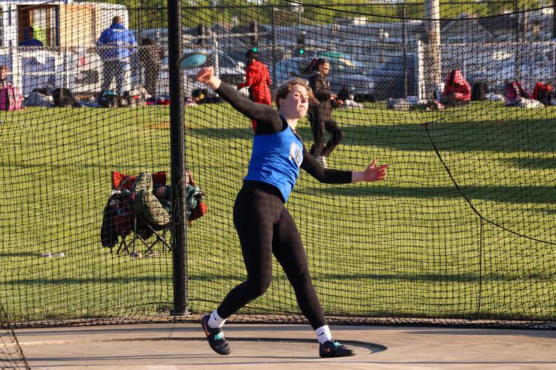 Lincoln-Way East's Abby Grant throws discus during the IHSA Class 3A Chicago Heights Girls Track and Field Sectional at Bloom High School on Wednesday, May 13, 2026. Grant took second place and qualified for state with a distance of 39.58 meters.