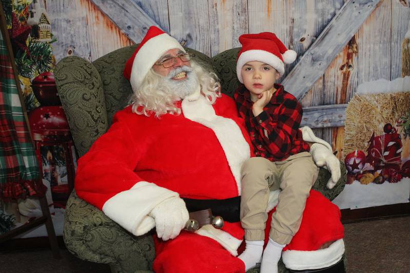 Candace H. Johnson for Shaw Local News Network
Santa visits with Joey Milone, 7, of Antioch during The Penny’s Purpose Annual Blanket Drive in Antioch. Joey's mother, Dori, is a board member of The Penny's Purpose.  (12/17/22)