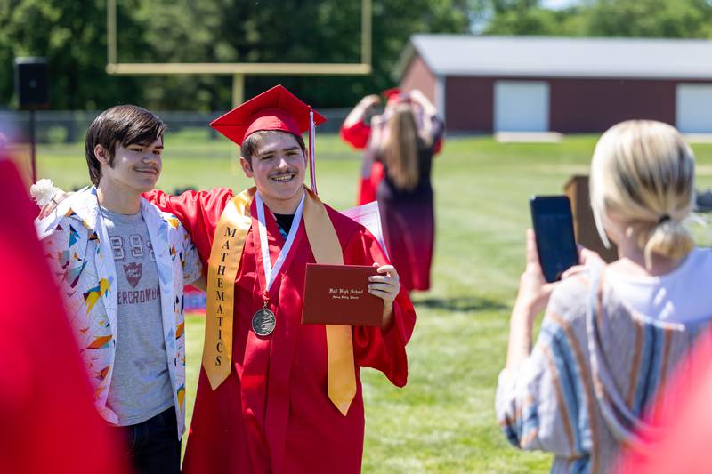 Graduate takes photo on Sunday, May 18, 2025 at Hall High School in Spring Valley.