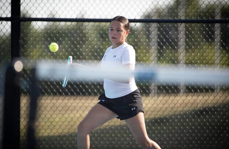 Kankakee's Samantha Medina makes a return hit against Bradley-Bourbonnais' Lauren Fischer on Wednesday, September 10, 2025.