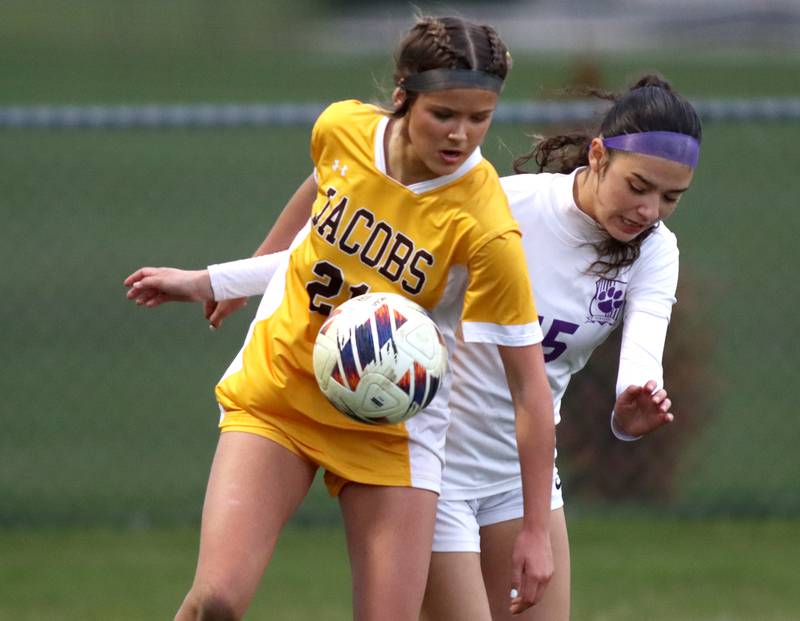 Jacobs’ Kylie Deegan, front, battles Hampshire’s Kassandra Solis in varsity girls soccer on Thursday, April 17, 2025, at Jacobs High School in Algonquin.