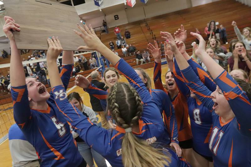 Members of the Genoa-Kingston volleyball team hoist the Class 2A Supersectional plaque after defeating Quincy Notre Dame in three sets in the Class 2A Supersectional volleyball game on Friday, Nov. 4, 2022 at Princeton High School.