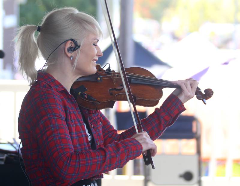 Fiddle Rocker Casey McGrath plays music during the 5x4th annual Burgoo on Sunday, Oct. 13, 2024 downtown Utica.