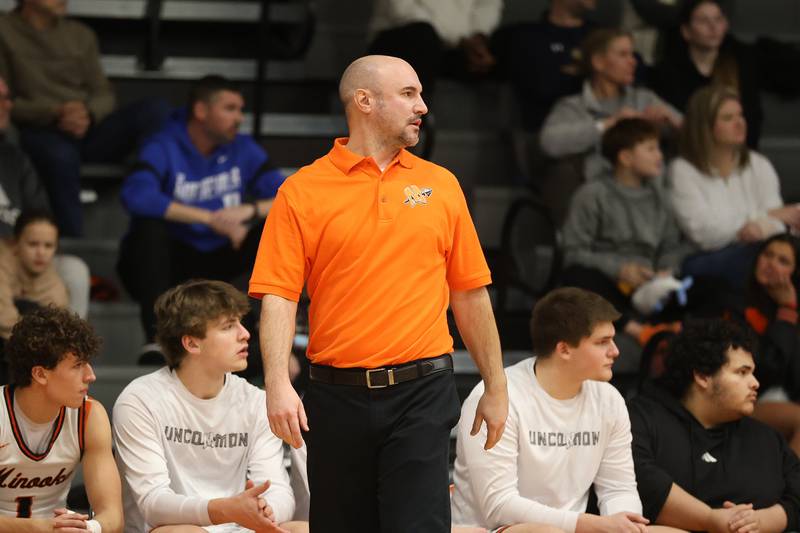 Minooka head coach Brett Hespell walks the sidelines against Oswego East on Friday, Jan. 16, 2026 in Minooka.