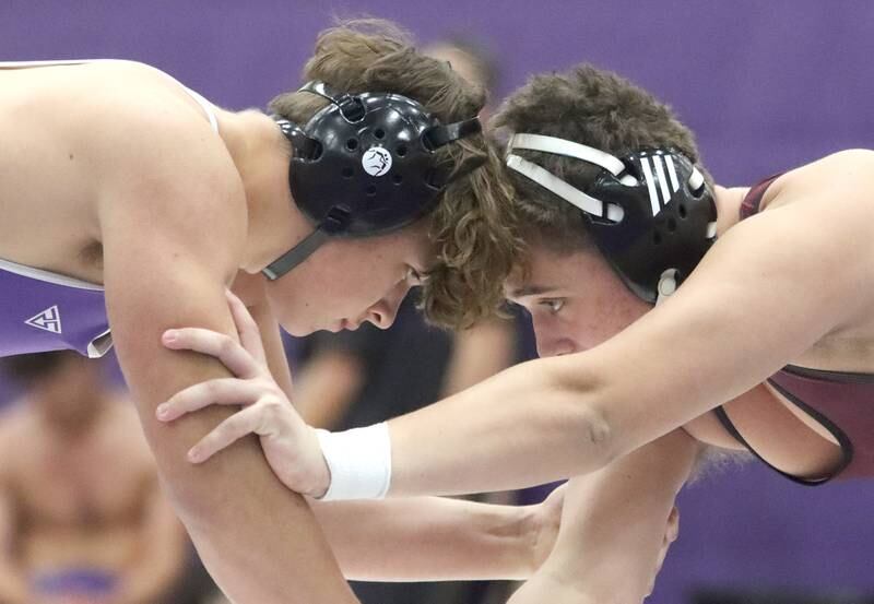 Hampshire’s Knox Homola, left, battles Prairie Ridge’s Anthony Debelak at 285 pounds in varsity wrestling on Thursday, Dec. 5, 2024 at Hampshire High School in Hampshire.