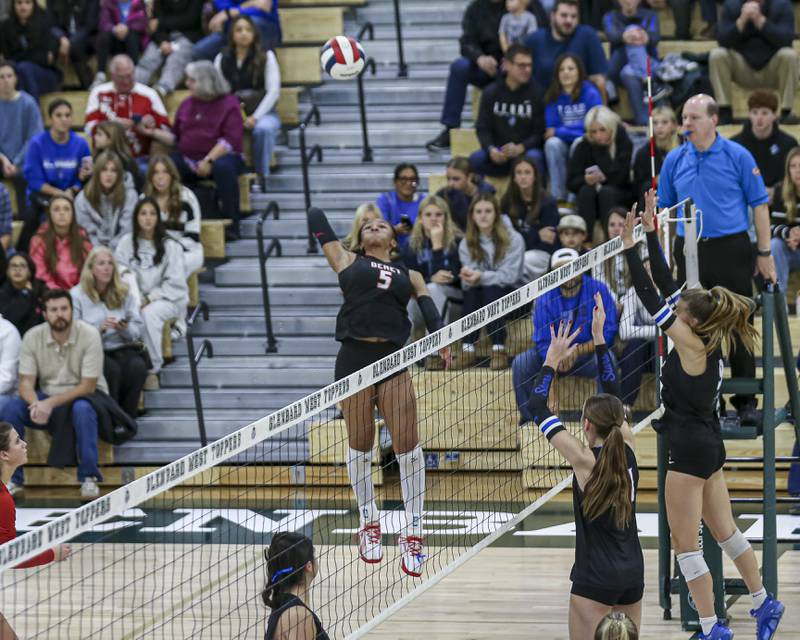 Benet's Brooklynne Brass (5) goes for a kill during Class 4A Glenbard West Sectional final volleyball match between St Charles North at Benet. Nov 6, 2025 in Glen Ellyn.